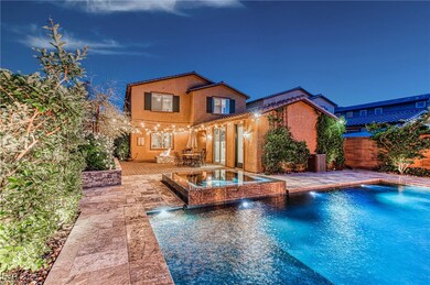 Back of property with stucco siding, fence, a pool