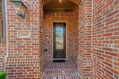 The front door has a covered entryway.