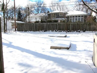 Large backyard with gardening area.