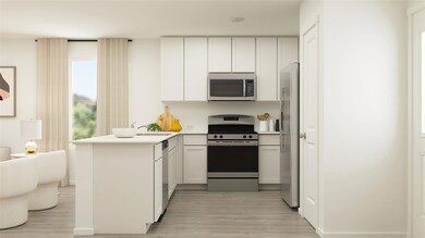Kitchen featuring light wood-style flooring, a pen