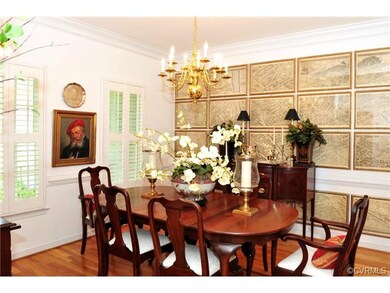 Formal Dining Room with hardwood floors, crown and