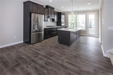 Gourmet kitchen conveniently located between the l
