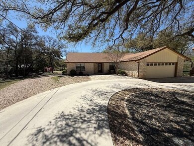 View of front of house featuring driveway, an att