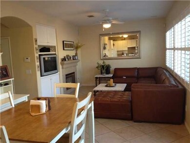 Relax and entertain in your Family room that has a Frielplace, ceiling fan, Tile flooring, built in TV cabinet, Plantation Shutters and Surround sound throughout!