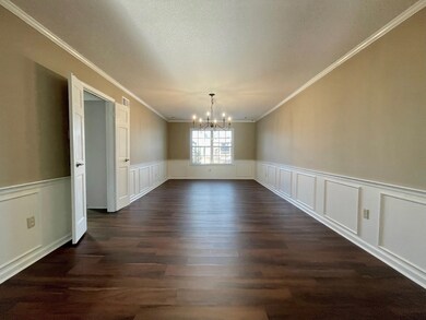 Unfurnished dining area featuring a chandelier, da