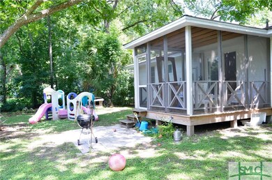 Fenced yard with screened porch