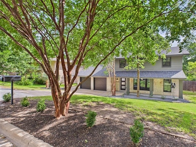 View of front of property featuring roof with shi