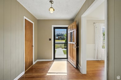Entryway featuring wood flooring.