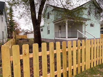 View of property exterior featuring covered porch
