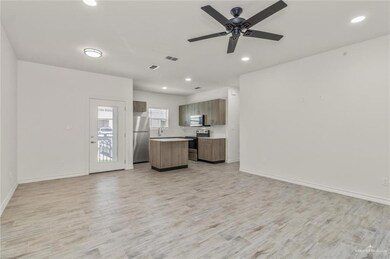 Unfurnished living room featuring baseboards, light wood-type flooring, recessed lighting, and ceiling fan