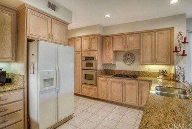 Upgraded kitchen with granite counters, double ove