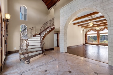 A stone archway adds architectural interest, seaml