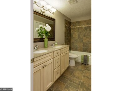 Upper level full bath with master walk through
