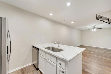 Kitchen with sink, light hardwood / wood-style flo