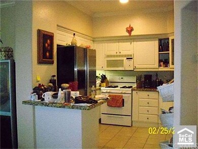 kitchen with granite counter tops, breakfast bar