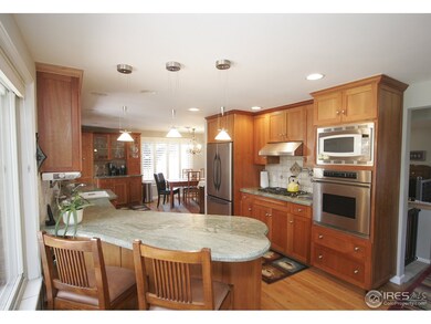 Custom cherry kitchen with handsome granite counte