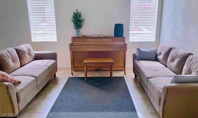 Living area featuring light tile patterned floorin