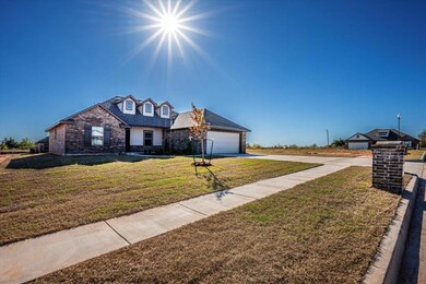 View of front of home featuring a garage and a fro