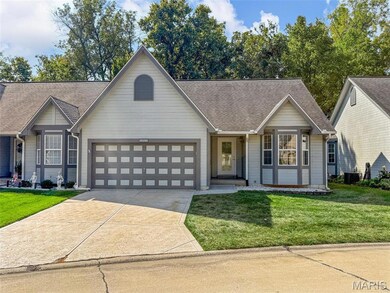 View of front facade with roof with shingles, a front lawn, concrete driveway, and a garage