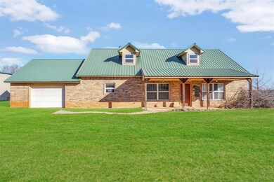 View of front of house featuring a front yard and 