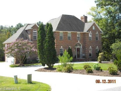 Exterior Front. Landscaping to the fullest! This home offera a 2 car garage and nice paving which accents the circle drive.