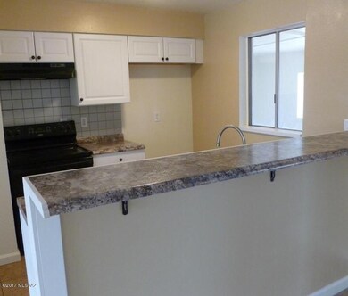 Kitchen and breakfast bar