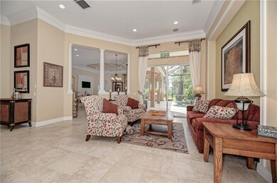 Living Room opens to Pool.  12 ft ceilings, high b