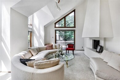 The dramatic formal living room offers vaulted cei