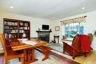Living/Dining Room with fireplace and window seat