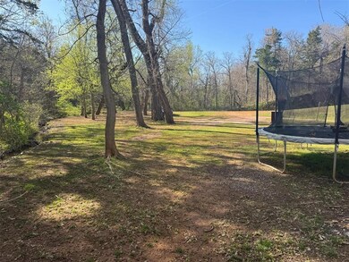 View of yard with a trampoline