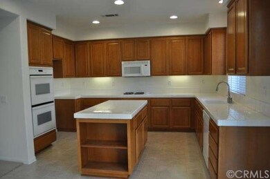 Gourmet kitchen with maple cabinets, double oven, 