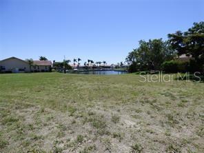 Photo taken from the road looking towards the waterfront. This lot will accommodate a larger home, pool and 3 car garage! Ask agent for suggested builders.