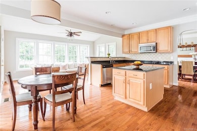 The kitchen has great flow for entertaining. There is a spacious eat-in area with a hanging drum light, and a expansive morning room located behind the breakfast bar.