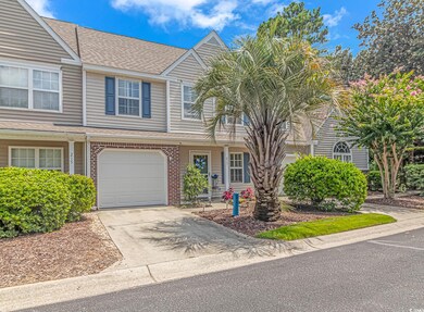 Townhome / multi-family property with a garage