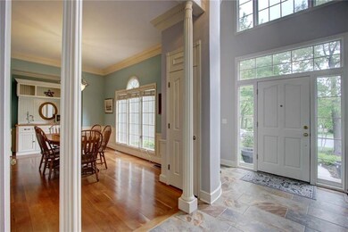 Beautiful view of front door, tile entry & large d
