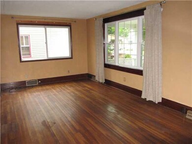Living Room Hardwood Floors and Newer Windows Thro