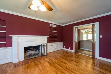 Living room leading to wet bar and family room.
