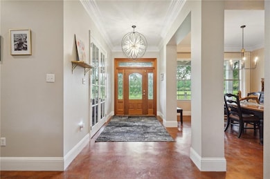 Entryway. Durable painted concrete flooring throughout the home.