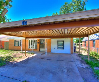 View of front of house featuring a carport