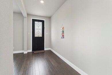 Foyer featuring dark wood-type flooring