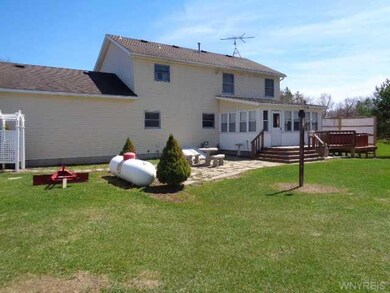 Exterior Back. There is a flagstone patio along wi