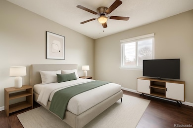 Virtually staged 1st bedroom with 2 windows and mirrored closet doors