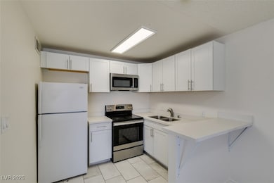 Kitchen with appliances with stainless steel finis