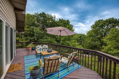 Part of the wrap around front deck with entrance t