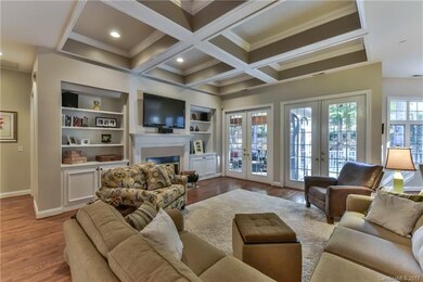 Large open great room with coffered ceilings ,fire