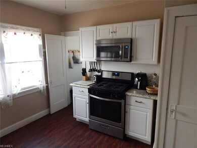 Kitchen with white cabinets and stainless steel ap