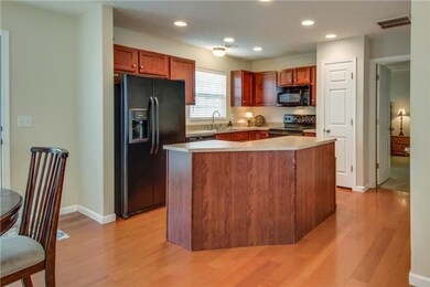 Kitchen island expands counter space and storage. 