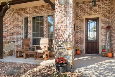 Covered front porch and landscaping add to the won