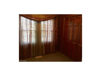 Large ceramic entry boasts large guest closet and 