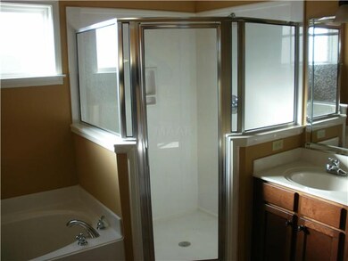 View of the MBR bath..tile floor.large walk-in clo